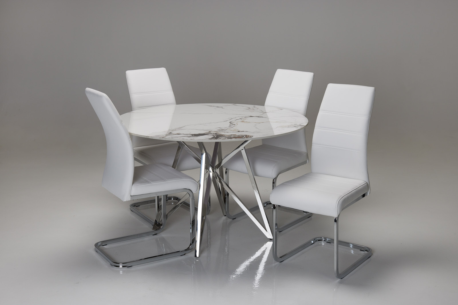 Jeni & Milan Dining Set - 1.2m Patagonia White Stone Round Dining Table with 4 White Faux Leather Cantilever Dining Chairs