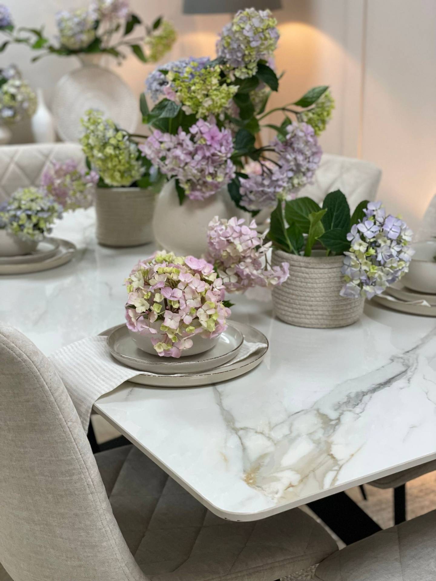 Cassis Stone Dining Table with floral table setting