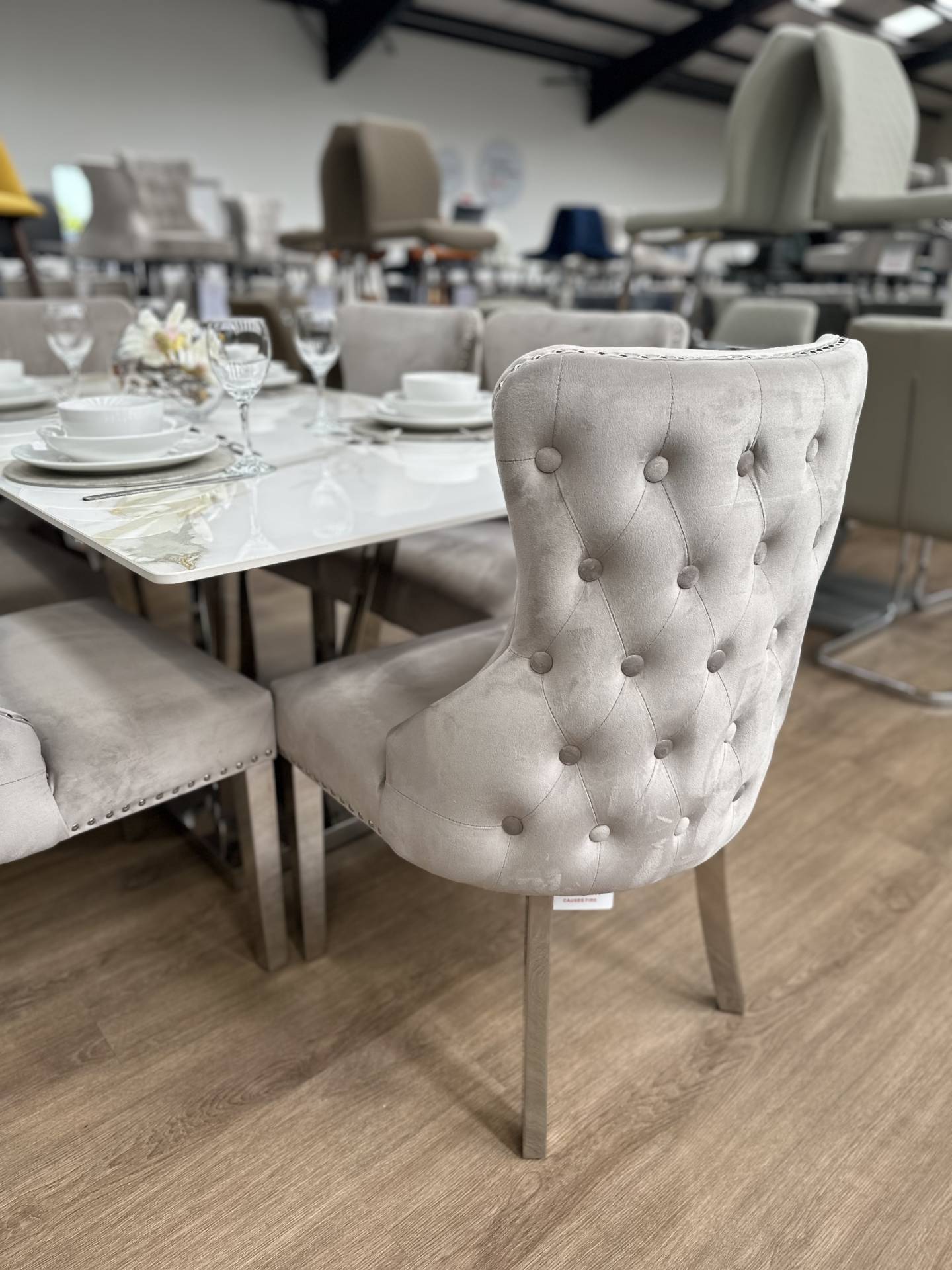 Velvet Dining Chairs with a Stone Dining Table at Furniture Outlet