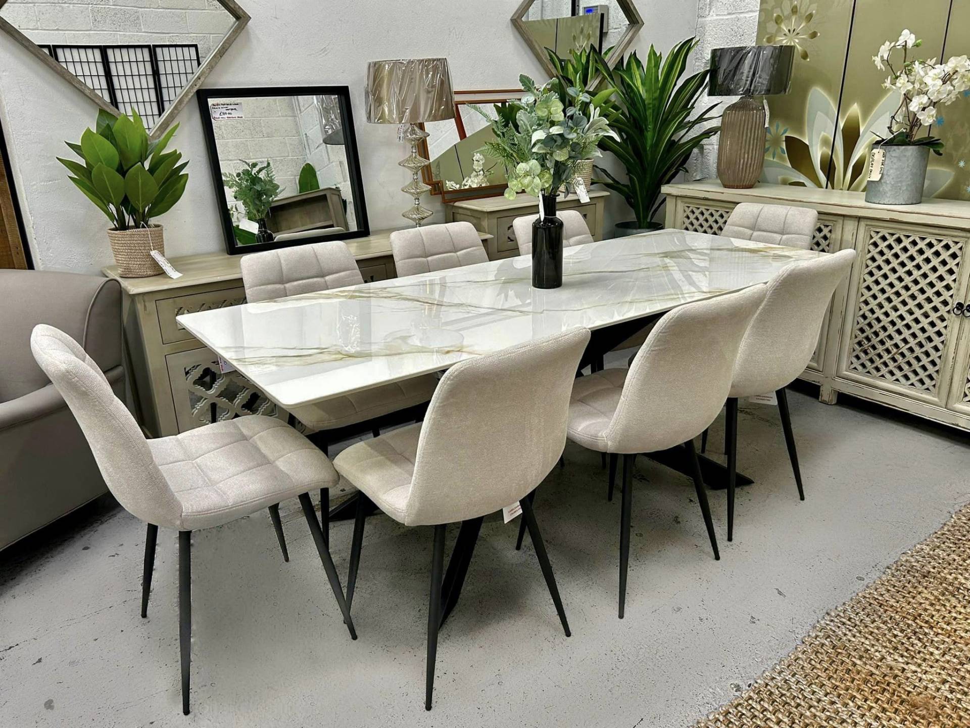 Oatmeal coloured dining chairs and stone dining table