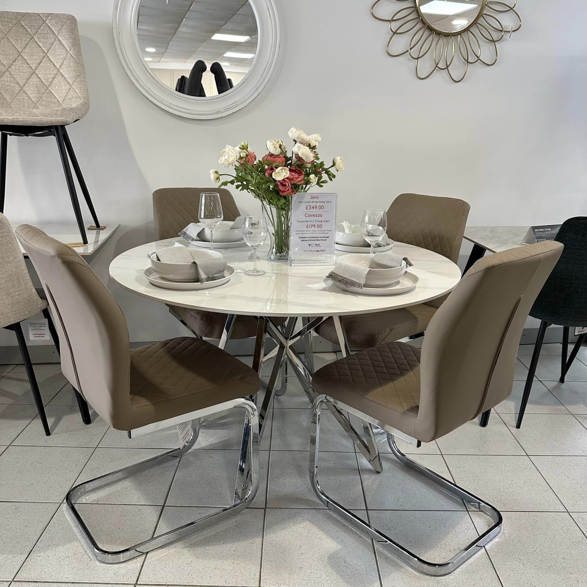 Cavezzo Taupe Cantilever Chairs with stone round dining table