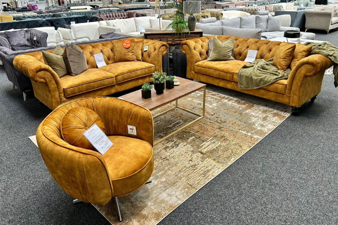 Gold velvet sofas & swivel armchair at Furniture Outlet Stores