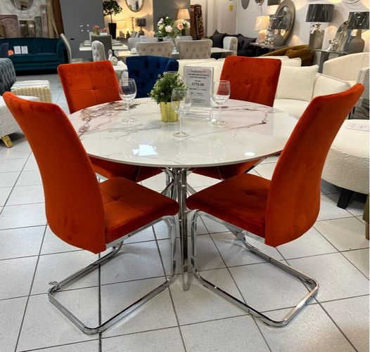 Dining set with orange cantilever chairs