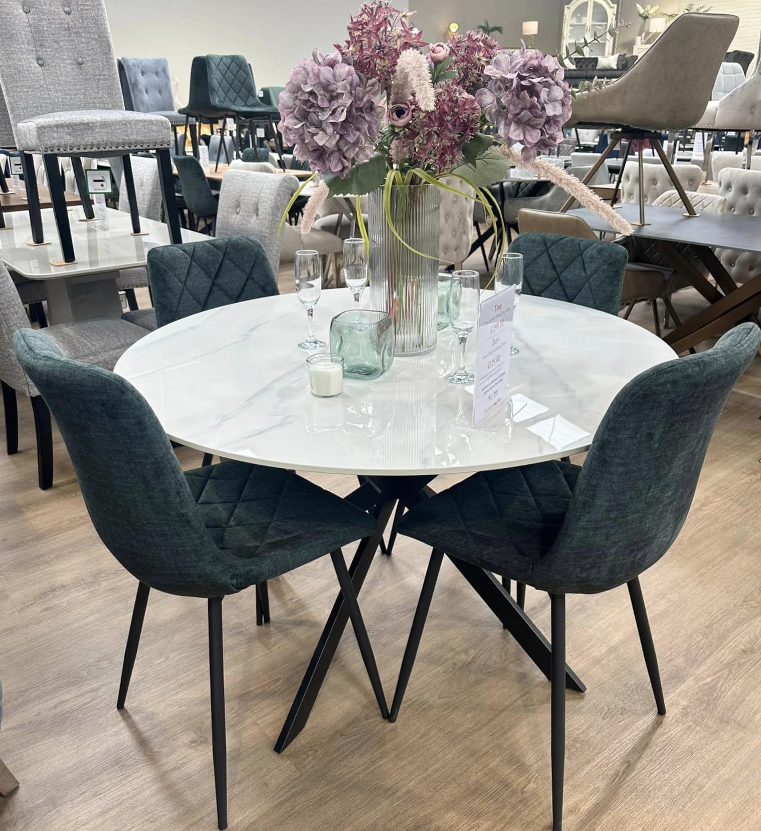 Tino round stone dining table with Bari velvet chairs