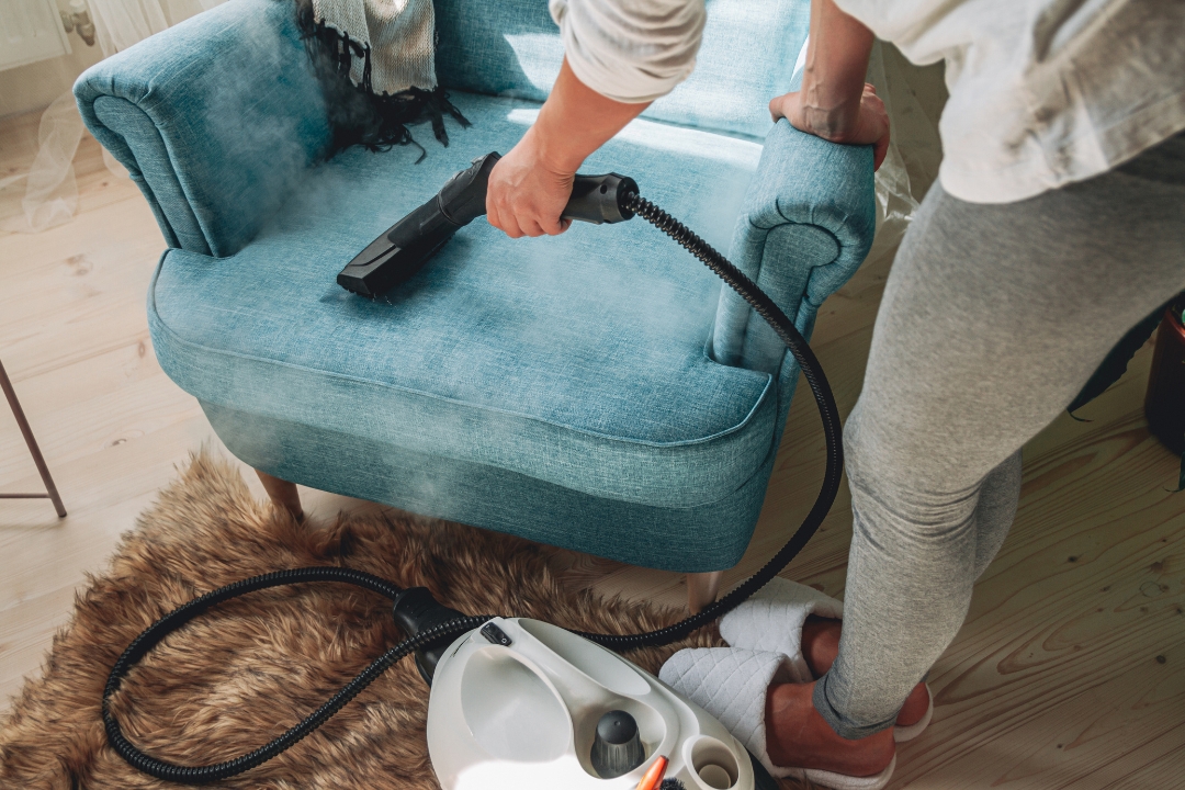 Vacuuming an armchair