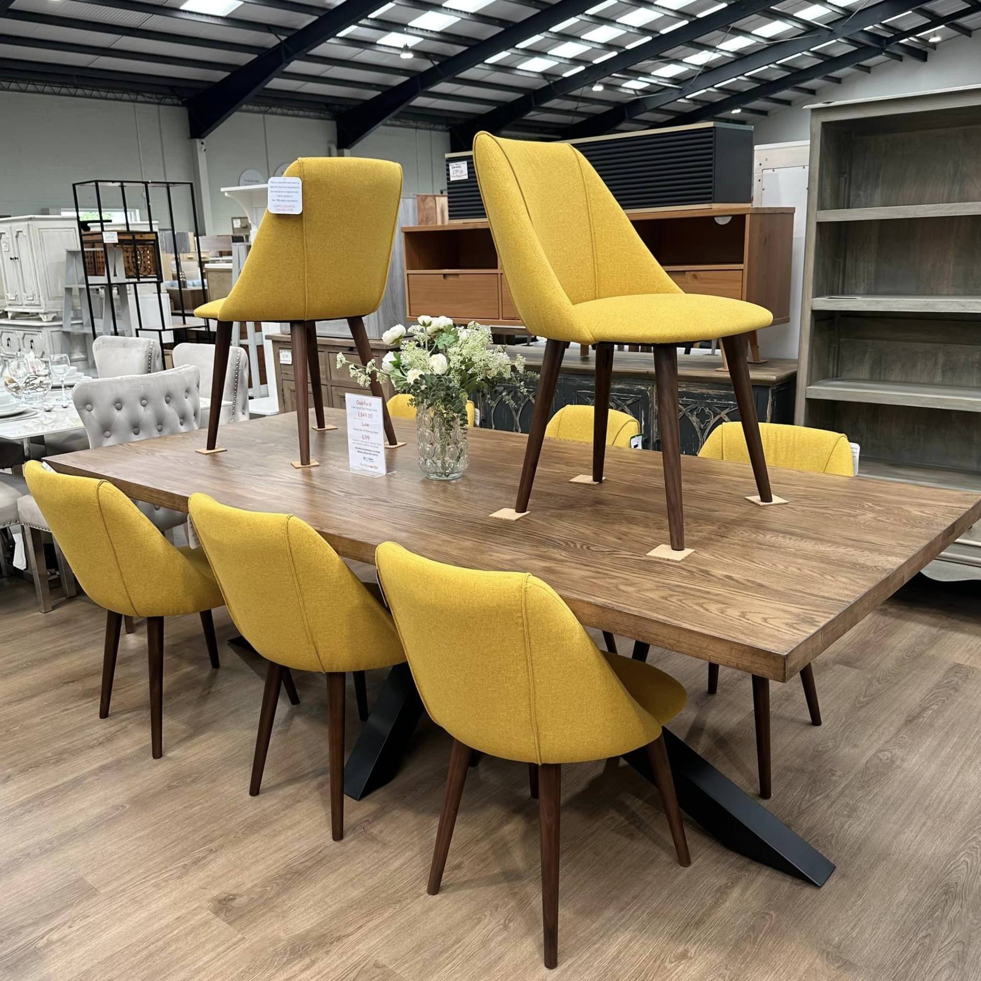 Oakford solid oak dining table and 8 Lule Yellow dining chairs