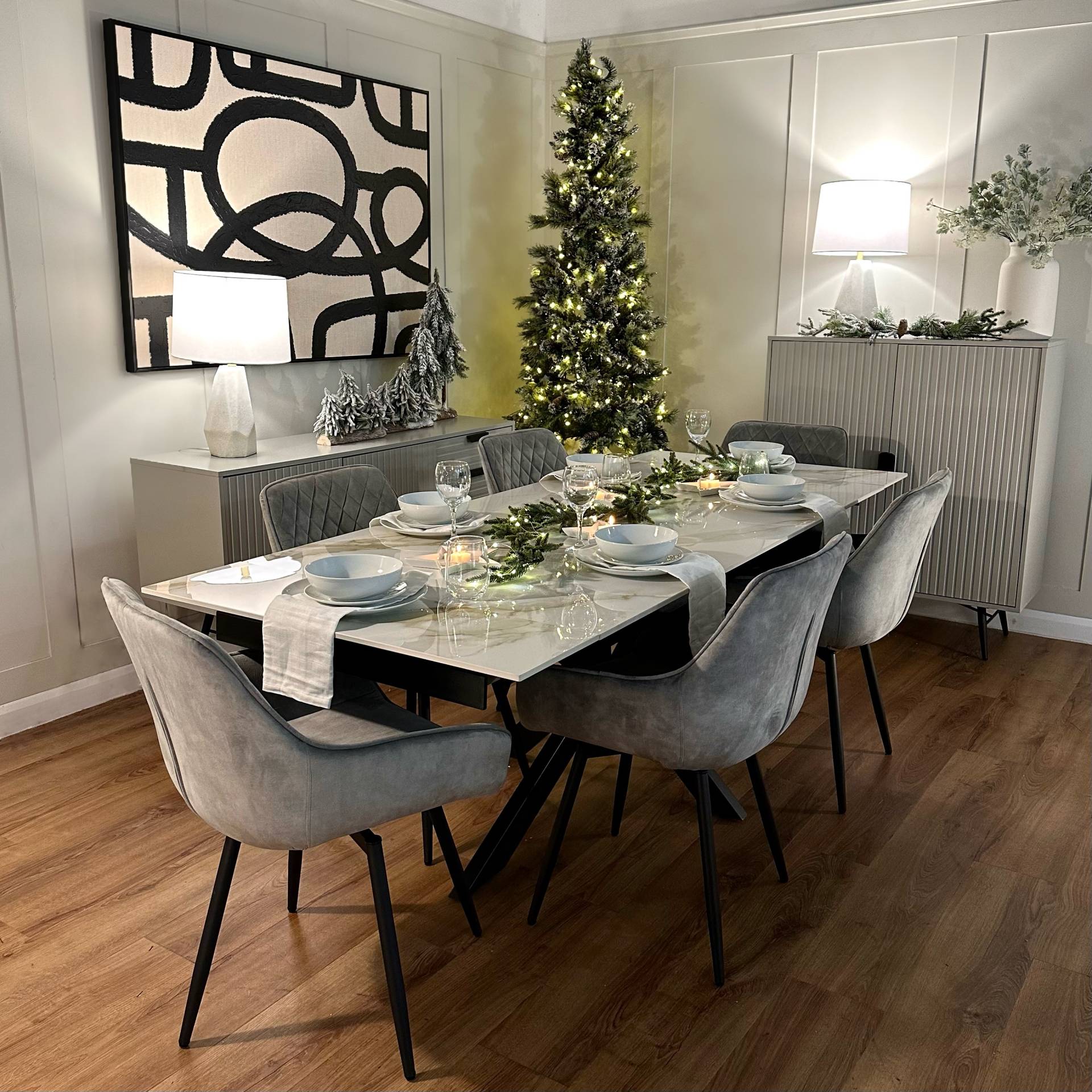 Modern stone dining table & velvet swivel dining chairs set at Christmas