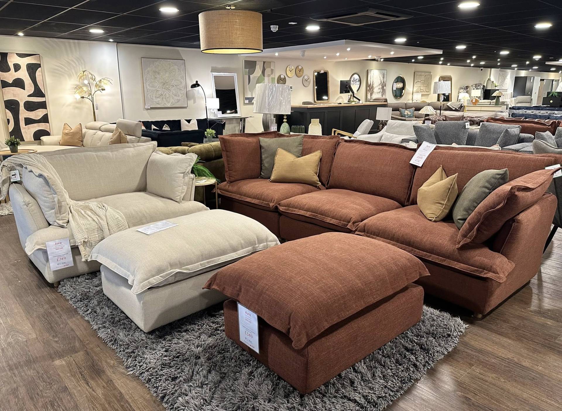 Modular Aura sofas in cream and rust fabric on display at the Furniture Outlet Charlton store