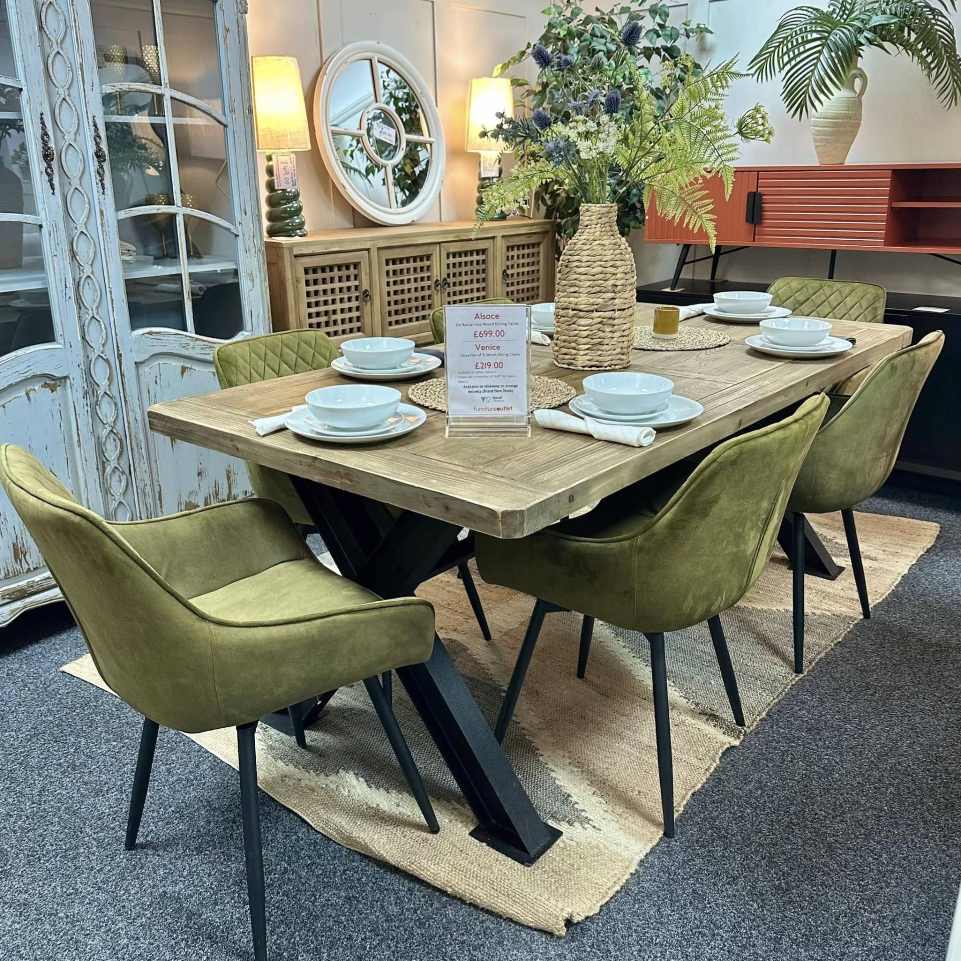Olive green swivel dining chairs with reclaimed wood dining table at Furniture Outlet