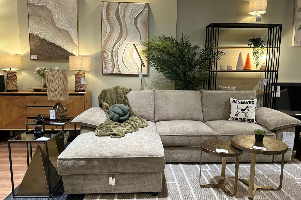 Modern open-plan living room with Como beige L shape sofa, styled with accessories, plants and layered lighting