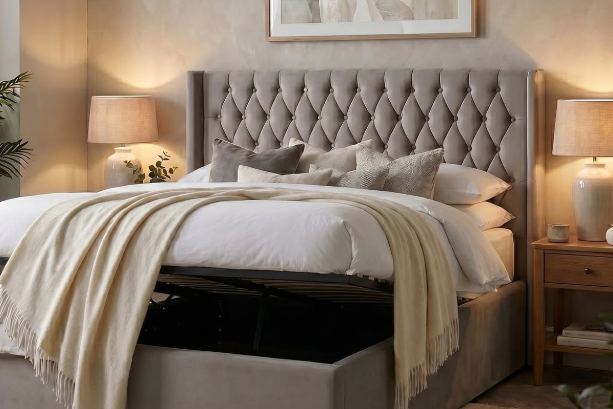 Grey upholstered ottoman bed lifted open showing under mattress storage in a calm, neatly styled bedroom [Interior Design Mockup]